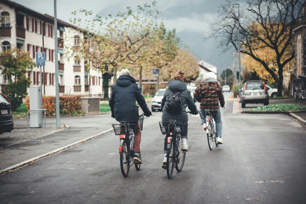 Family riding bicycles together through a peaceful Chilliwack neighbourhood.